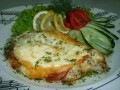 Телампия запеченная с помидорами под сыром